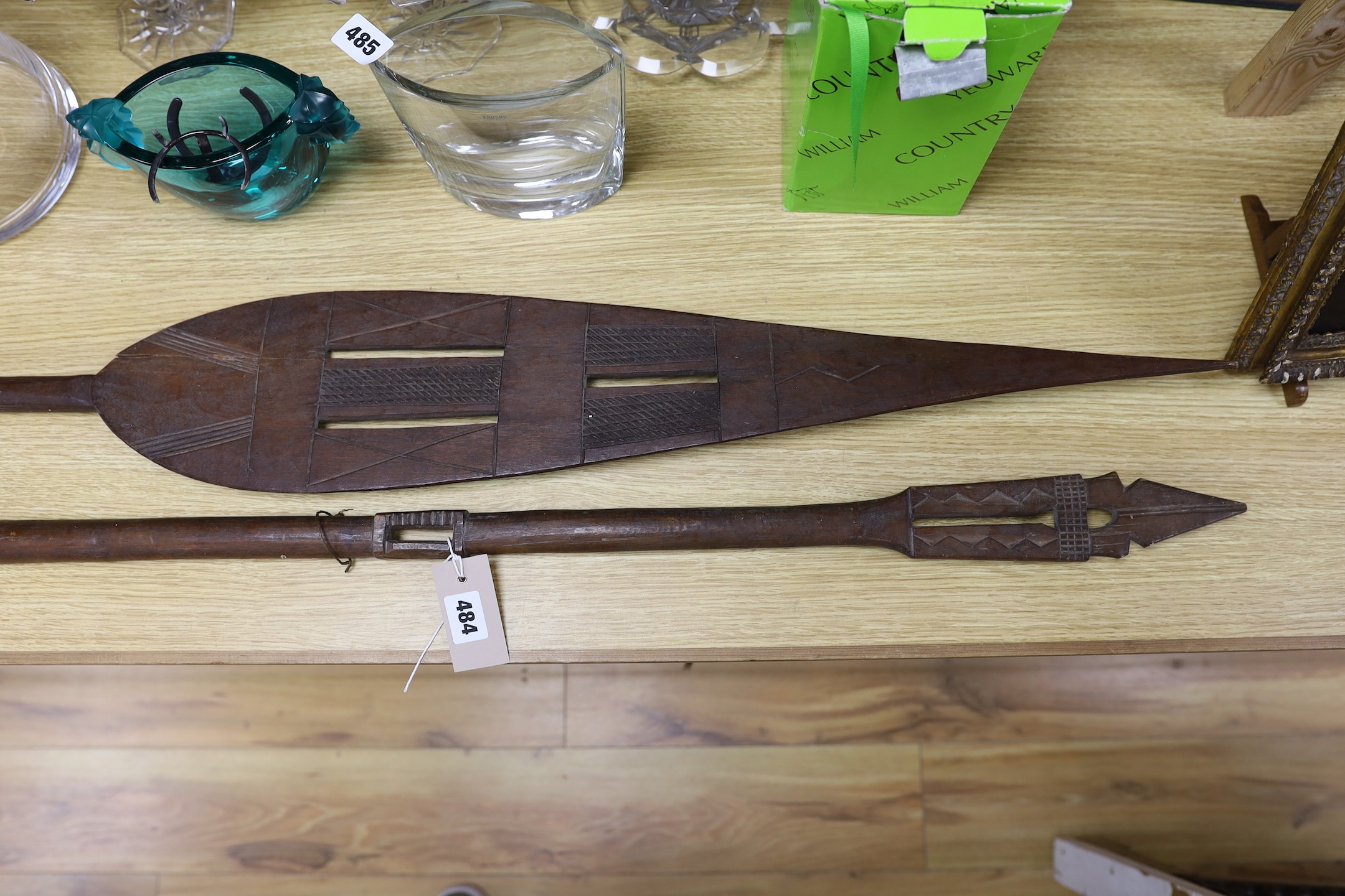 A pair of carved wood paddles, possibly Polynesian. 155cm long